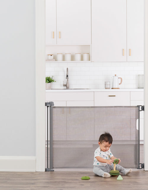 Load image into Gallery viewer, Retractable Baby Gate, Expands up to 50&quot; Wide, Includes Wall Mounts
